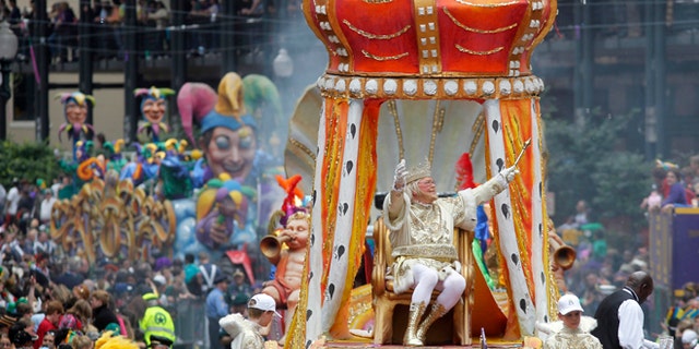 FILE - In this March 8, 2011 file photo, Rex, the King of Carnival rides in the Krewe of Rex as he arrives at Canal St. on Mardi Gras day in New Orleans.