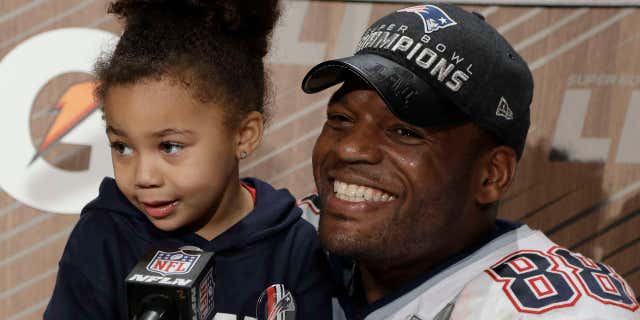 New England Patriots' Martellus Bennett appears at a news conference with his daughter Austyn Jett Rose Bennett after the NFL Super Bowl 51 football game Sunday, Feb. 5, 2017, in Houston.