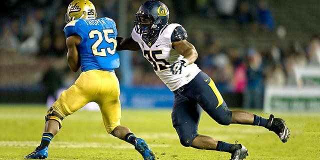 This Oct. 12, 2013 photo released by GoldenBearSports.com shows California's Ted Agu, right, tackling UCLA's Damien Thigpen, in Pasadena, Calif. Agu died Friday morning, Feb. 7, 2014. He was 21. The school announced Agu's death and said its thoughts and prayers were with Agu's family, friends and teammates. The school said it would give more information about the circumstances later. (AP Photo/GoldenBearSports.com, Michael Pimentel) MANDATORY CREDIT