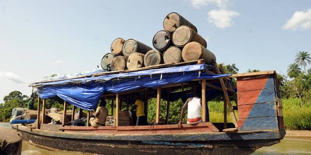 Jerry cans are ferried to the market in Bayelsa State of Niger Delta on April 11, 2013