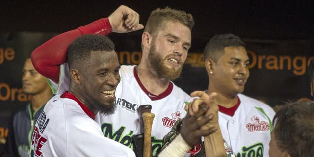 Mexico teammates celebrate after defeating Venezuela in the final game of the 2016 Caribbean baseball series in Santo Domingo, Dominican Republic, on February 7, 2016. AFP PHOTO/ERIKA SANTELICES / AFP / ERIKA SANTELICES (Photo credit should read ERIKA SANTELICES/AFP/Getty Images)