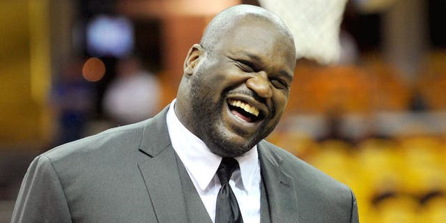 May 26, 2015; Cleveland, OH, USA; TNT analyst Shaquille O'Neal laughs on the court before game four of the Eastern Conference Finals of the NBA Playoffs between the Cleveland Cavaliers and the Atlanta Hawks at Quicken Loans Arena. Mandatory Credit: Ken Blaze-USA TODAY Sports