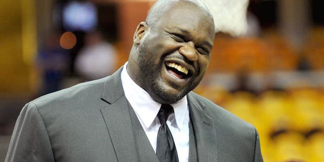 May 26, 2015; Cleveland, OH, USA; TNT analyst Shaquille O'Neal laughs on the court before game four of the Eastern Conference Finals of the NBA Playoffs between the Cleveland Cavaliers and the Atlanta Hawks at Quicken Loans Arena. Mandatory Credit: Ken Blaze-USA TODAY Sports