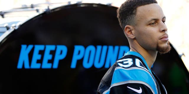 SANTA CLARA, CA - FEBRUARY 07: Stephen Curry of the Golden State Warriors prepares to hit the "Keep Pounding" drum for the Carolina Panthers prior to Super Bowl 50 against the Denver Broncos at Levi's Stadium on February 7, 2016 in Santa Clara, California. (Photo by Kevin C. Cox/Getty Images)