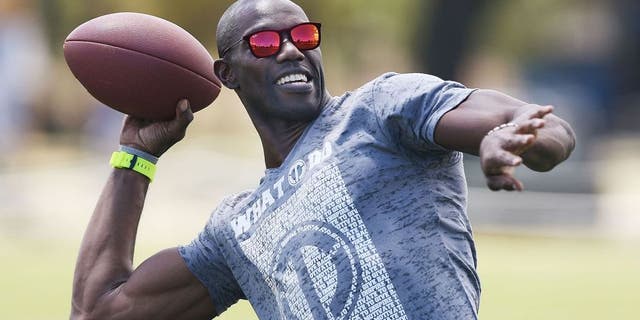 MELBOURNE, AUSTRALIA - JANUARY 30: Former NFL star Terrell Owens throws a gridiron ball during a Hawthorn Hawks AFL media opportunity at Gosch's Paddock on January 30, 2015 in Melbourne, Australia. The Hawks hosted former NFL star Terrell Owens who is in town for the Ultimate Aussie Super Bowl Party in Docklands. (Photo by Michael Dodge/Getty Images)