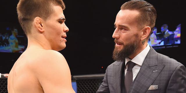 LAS VEGAS, NV - FEBRUARY 06: (R-L) Phil 'CM Punk' Brooks congratulates Mickey Gall after Gall's victory over Mike Jackson during the UFC Fight Night event at MGM Grand Garden Arena on February 6, 2016 in Las Vegas, Nevada. (Photo by Jeff Bottari/Zuffa LLC/Zuffa LLC via Getty Images)
