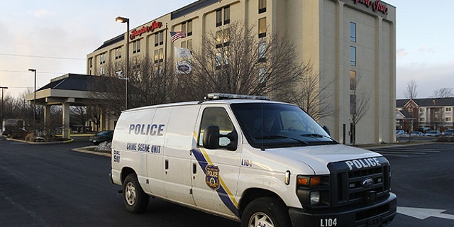 Feb. 8: A Philadelphia Police Department Crime Scene Unit van pulls away from a Hampton Inn in Philadelphia. Police say they're investigating the death of a woman who had a cosmetic injection into her buttocks at the hotel.