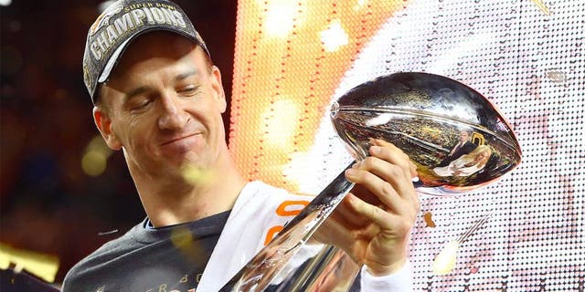 Feb 7, 2016; Santa Clara, CA, USA; Denver Broncos quarterback Peyton Manning (18) hoists the Vince Lombardi Trophy after defeating the Carolina Panthers in Super Bowl 50 at Levi's Stadium. Mandatory Credit: Mark J. Rebilas-USA TODAY Sports
