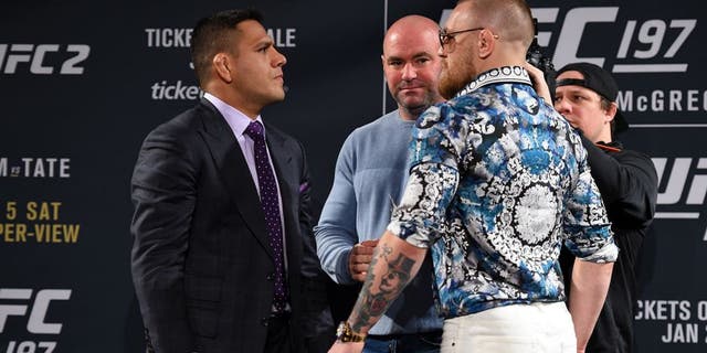 LAS VEGAS, NV - JANUARY 20: Rafael dos Anjos of Brazil (L) and Conor McGregor of Ireland (R) face off during the UFC 197 on-sale press conference event inside MGM Grand Hotel & Casino on January 20, 2016 in Las Vegas, Nevada. (Photo by Jeff Bottari/Zuffa LLC/Zuffa LLC via Getty Images)