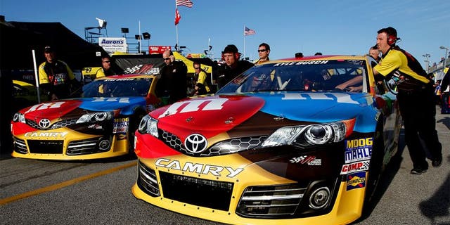 DAYTONA BEACH, FL - FEBRUARY 15: The #18 car driven by Kyle Busch is put into the garage before practice for the NASCAR Sprint Cup Series Sprint Unlimited at Daytona International Speedway on February 15, 2013 in Daytona Beach, Florida. (Photo by Nick Laham/Getty Images)