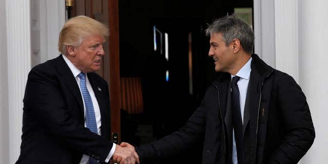 U.S. President-elect Donald Trump emerges with Ari Emanuel after their meeting in at the Trump National Golf Club in Bedminster, N.J.