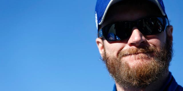MARTINSVILLE, VA - OCTOBER 30: Dale Earnhardt Jr., driver of the #88 Nationwide Chevrolet, stands on the grid during qualifying for the NASCAR Sprint Cup Series Goody's Headache Relief Shot 500 at Martinsville Speedway on October 30, 2015 in Martinsville, Virginia. (Photo by Jeff Zelevansky/Getty Images)