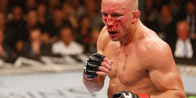 LAS VEGAS, NV - NOVEMBER 16: Georges St-Pierre stands in the Octagon during his UFC welterweight championship bout against Johny Hendricks during the UFC 167 event inside the MGM Grand Garden Arena on November 16, 2013 in Las Vegas, Nevada. (Photo by Josh Hedges/Zuffa LLC/Zuffa LLC via Getty Images) *** Local Caption *** Georges St-Pierre