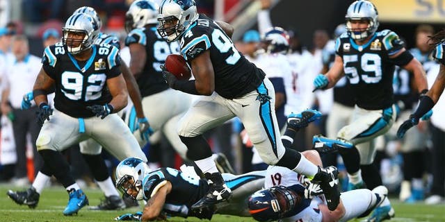 Feb 7, 2016; Santa Clara, CA, USA; Carolina Panthers defensive end Kony Ealy (94) returns an interception against the Denver Broncos in the second quarter in Super Bowl 50 at Levi's Stadium. Mandatory Credit: Mark J. Rebilas-USA TODAY Sports