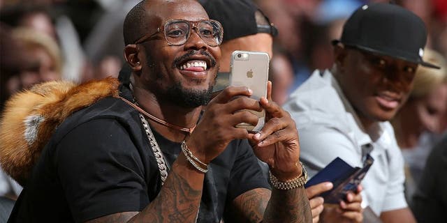 DENVER, CO - NOVEMBER 13: Von Miller of the Denver Broncos uses his iPhone as he watches from courtside as the Houston Rockets face the Denver Nuggets at Pepsi Center on November 13, 2015 in Denver, Colorado. The Nuggets defeated the Rockets 107-98. NOTE TO USER: User expressly acknowledges and agrees that, by downloading and or using this photograph, User is consenting to the terms and conditions of the Getty Images License Agreement. (Photo by Doug Pensinger/Getty Images)