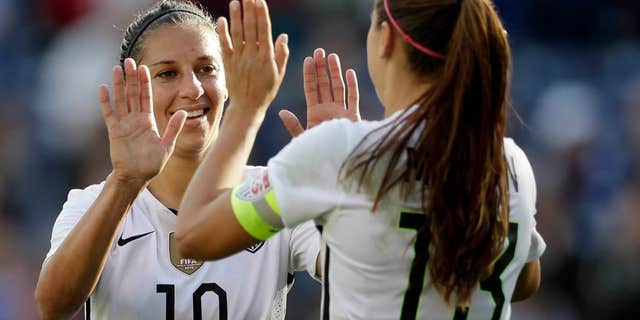 Jan. 23, 2016: he United States' Carli Lloyd (10) celebrates a goal with teammate Alex Morgan, right, during the first half in a women's international friendly soccer game against Ireland.