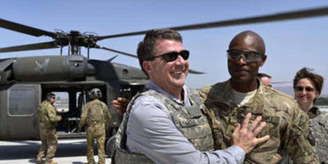 Former Defense Secretary Ash Carter with Maj. Gen. Ronald Lewis