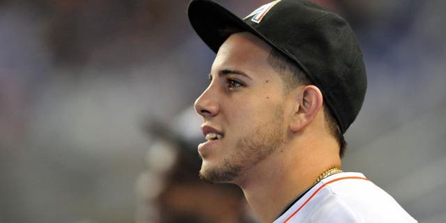Sep 29, 2013; Miami, FL, USA; Miami Marlins starting pitcher Jose Fernandez (16) looks on from the dugout before a game against the Detroit Tigers at Marlins Ballpark. The Marlins won 1-0. Mandatory Credit: Steve Mitchell-USA TODAY Sports