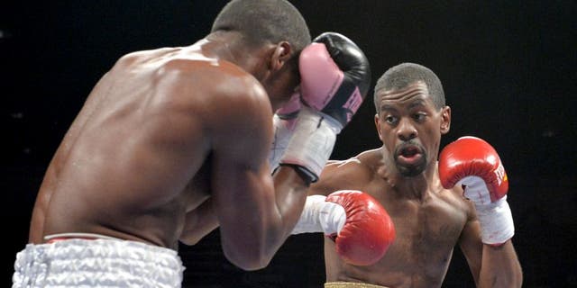 Antonio Sanchez (L) of Bayamon, Puerto Rico, defends against Jamel Herring (R) of Coram, NY, USA, during their lightweight preliminary match at the DC Armory on January 25, 2014 in Washington, DC, ahead of the IBF Jr. welterweight title match between Lamont Peterson and Dierry Jean. Herring won a 6-round split decision. AFP PHOTO / Nicholas KAMM (Photo credit should read NICHOLAS KAMM/AFP/Getty Images)
