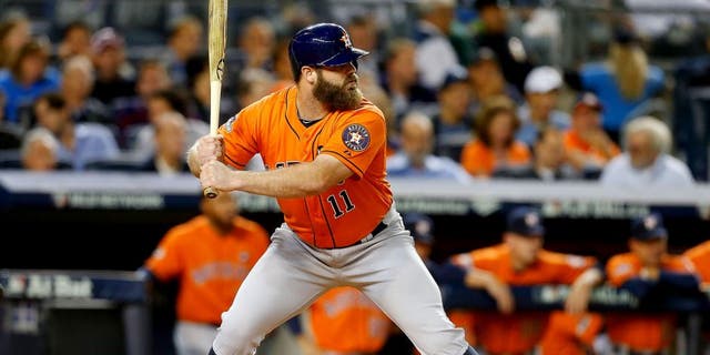NEW YORK, NY - OCTOBER 06: (NEW YORK DAILIES OUT) Evan Gattis #11 of the Houston Astros in action against the New York Yankees during the American League Wild Card Game at Yankee Stadium on October 6, 2015 in the Bronx borough of New York City, New York. The Astros defeated the Yankees 3-0. (Photo by Jim McIsaac/Getty Images)