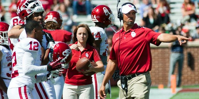 Apr 11, 2015; Norman, OK, USA; Oklahoma Sooners defensive line coach Diron Reynolds directs players during the spring football game at Gaylord Family Oklahoma Memorial Stadium. Red wins 20-7 over White. Mandatory Credit: Rob Ferguson-USA TODAY Sports