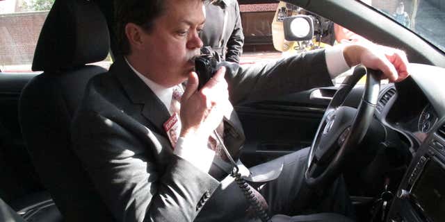 Andrew Wisniewski, an operations manager for Smart Start of Maryland, demonstrates how an ignition interlock device works on Wednesday, Feb. 10, 2016 in Annapolis, Maryland.