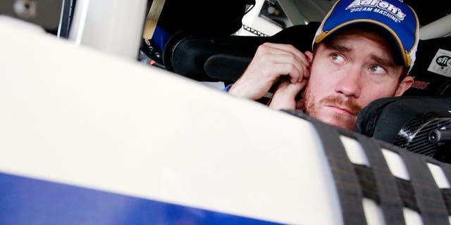 HOMESTEAD, FL - NOVEMBER 15: Brian Vickers, driver of the #55 Aaron's Dream Machine Toyota, sits in his car in the garage area during practice for the NASCAR Sprint Cup Series Ford EcoBoost 400 at Homestead-Miami Speedway on November 15, 2014 in Homestead, Florida. (Photo by Brian Lawdermilk/Getty Images)