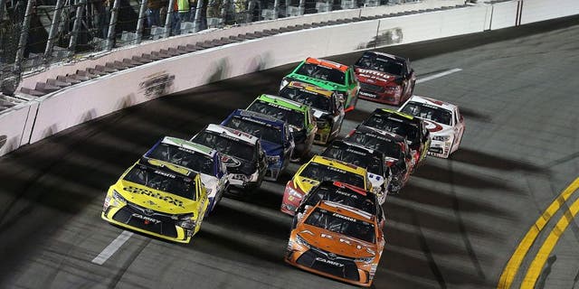 DAYTONA BEACH, FL - FEBRUARY 14: Matt Kenseth, driver of the #20 Dollar General Toyota, and Carl Edwards, driver of the #19 Arris Toyota, during the 3rd Annual Sprint Unlimited at Daytona at Daytona International Speedway on February 14, 2015 in Daytona Beach, Florida. (Photo by Patrick Smith/NASCAR via Getty Images)