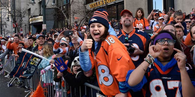 DENVER, CO - FEBRUARY 9: Broncos fans cheer as the players pass by on firetrucks. The city of Denver held a victory parade for the Denver Broncos, Super Bowl 50 champions, on Tuesday, February 9, 2016. (Photo by Joe Amon/The Denver Post via Getty Images)
