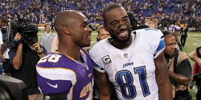 Nov 11, 2012; Minneapolis, MN, USA; Detroit Lions wide receiver Calvin Johnson (81) talks with Minnesota Vikings running back Adrian Peterson (28) following the game at the Metrodome. The Vikings defeated the Lions 34-24. Mandatory Credit: Brace Hemmelgarn-USA TODAY Sports