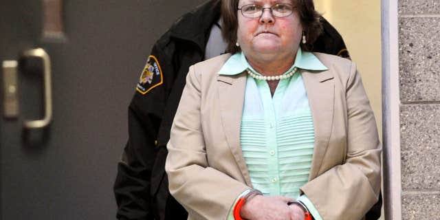 FILE - In a Tuesday, March 10, 2015 file photo, Joyce Hardin Garrard walks to the Etowah County Judicial Building from the Etowah County Detention Center in Gadsden, Ala.