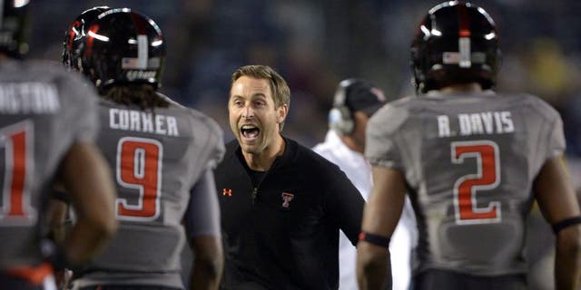 Dec 30, 2013; San Diego, CA, USA; Texas Tech Red Raiders coach Kliff Kingsbury celebrates after a touchdown against the Arizona State Sun Devils during the 2013 Holiday Bowl at Qualcomm Stadium. Mandatory Credit: Kirby Lee-USA TODAY Sports