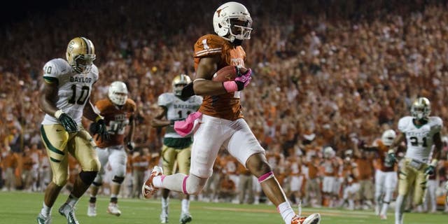 Oct 20, 2012; Austin, TX, USA; Texas Longhorns wide receiver Mike Davis (1) scores a touchdown against the Baylor Bears during the second half at Darrell K Royal-Texas Memorial Stadium. Texas beat Baylor 56-50. Mandatory Credit: Brendan Maloney-USA TODAY Sports