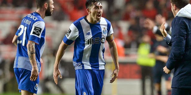 Porto's Mexican midfielder Hector Herrera (2nd L) celebrates a goal with teammate Porto's Mexican defender Miguel Layun (L) during the Portuguese league football match SL Benfica vs FC Porto at the Luz stadium in Lisbon on February 12, 2016. / AFP / PATRICIA DE MELO MOREIRA (Photo credit should read PATRICIA DE MELO MOREIRA/AFP/Getty Images)