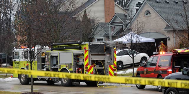 Jan. 31, 2016: Police and fire officials investigate a house fire that killed five people at a home in Novi, Mich..