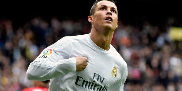 Real Madrid's Portuguese forward Cristiano Ronaldo celebrates after scoring during the Spanish league football match Real Madrid CF vs Athletic Club Bilbao at the Santiago Bernabeu stadium in Madrid on February 13, 2016. / AFP / GERARD JULIEN (Photo credit should read GERARD JULIEN/AFP/Getty Images)