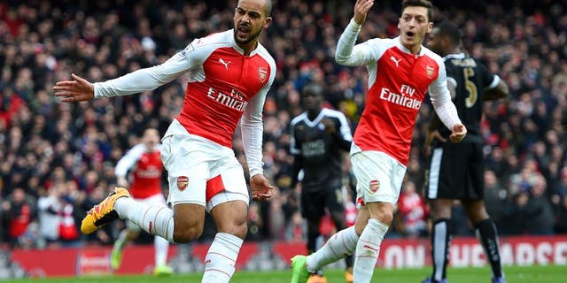 LONDON, ENGLAND - FEBRUARY 14: Theo Walcott of Arsenal celebrates after scoring his team's first goal during the Barclays Premier League match between Arsenal and Leicester City at Emirates Stadium on February 14, 2016 in London, England. (Photo by Ross Kinnaird/Getty Images)