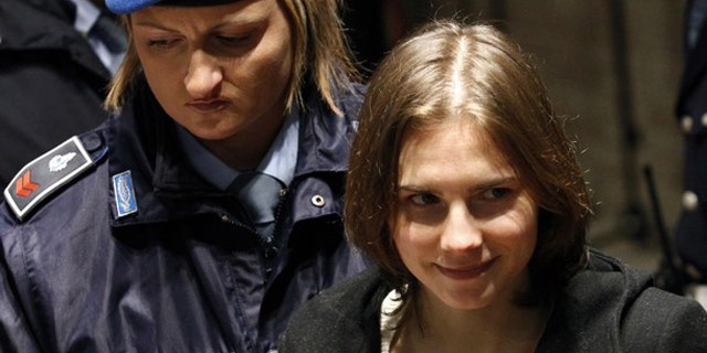 Jan. 22: Amanda Knox, the U.S. student convicted of killing her British flatmate in Italy in 2007, arrives back in court after a break during a trial session in Perugia.