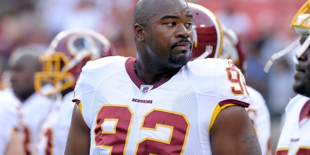In this Aug. 21, 2010, file photo, Washington Redskins defensive lineman Albert Haynesworth watches warm ups before an NFL preseason football game against the Baltimore Ravens in Landover, Md.