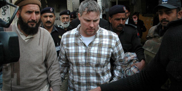 Jan. 28: Pakistani security officials escort Raymond A. Davis, a U.S. consulate employee, to a local court in Lahore, Pakistan.