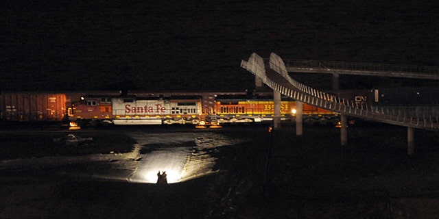Feb. 26: ights from a truck illuminate train cars near Chambers Bay in University Place, Wash., after two trains collided.