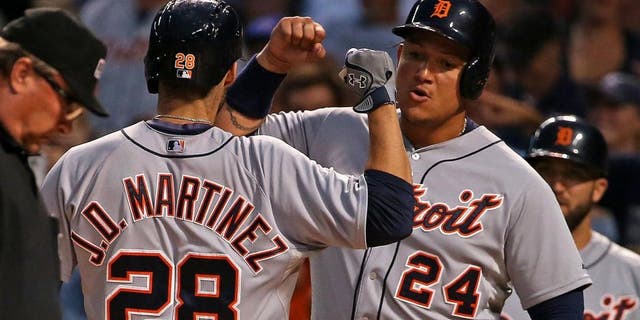 CHICAGO, IL - AUGUST 18: J.D. Martinez #28 of the Detroit Tigers is greeted by Miguel Cabrera #24 after he hit a two-run home run in the 1st inning against the Chicago Cubs at Wrigley Field on August 18, 2015 in Chicago, Illinois. (Photo by Jonathan Daniel/Getty Images)
