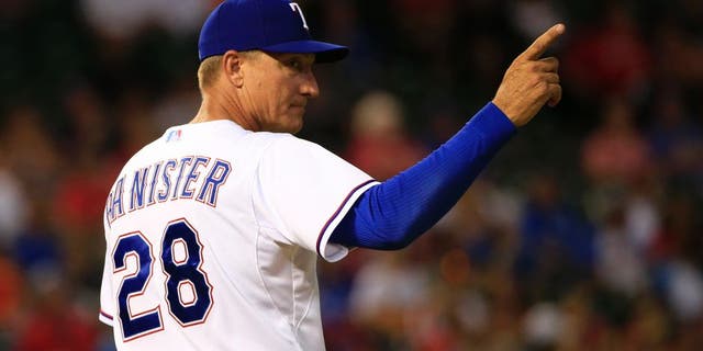 Aug 3, 2015; Arlington, TX, USA; Texas Rangers manager Jeff Banister (28) makes a pitching change during the game against the Houston Astros at Globe Life Park in Arlington. Mandatory Credit: Kevin Jairaj-USA TODAY Sports