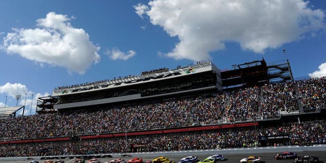 DAYTONA BEACH, FL - FEBRUARY 22: Jeff Gordon, driver of the #24 Drive To End Hunger Chevrolet, and Jimmie Johnson, driver of the #48 Lowe's Chevrolet, lead the field to the green flag for the running of the NASCAR Sprint Cup Series 57th Annual Daytona 500 at Daytona International Speedway on February 22, 2015 in Daytona Beach, Florida. (Photo by Jared C. Tilton/Getty Images)