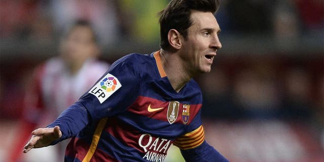 Barcelona's Argentinian forward Lionel Messi celebrates after scoring a goal during the Spanish league football match Real Sporting de Gijon vs FC Barcelona at El Molinon stadium in Gijonon 2016. AFP PHOTO / MIGUEL RIOPA / AFP / MIGUEL RIOPA (Photo credit should read MIGUEL RIOPA/AFP/Getty Images)