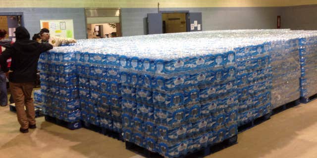 Pallets of water, ready for distribution in the community, sit at the Sebring Community Center, Tuesday, Jan. 26, 2016 in Sebring, Ohio.