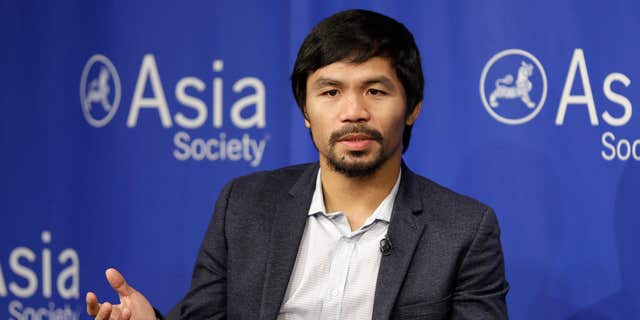 FILE - In this Oct. 12, 2015, file photo, Manny Pacquiao takes questions at the Asia Society in New York.