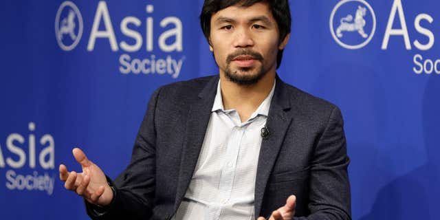 FILE - In this Oct. 12, 2015, file photo, Manny Pacquiao takes questions at the Asia Society in New York.