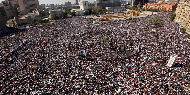 Feb. 18: Thousands pray during Friday prayers at Tahrir square in Cairo, Egypt.