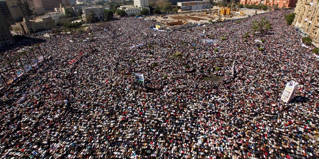 Feb. 18: Thousands pray during Friday prayers at Tahrir square in Cairo, Egypt.